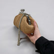 Leather and raffia bag with Meloro clasp.
