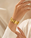 Ellipse Form Brushed Gold Bangle Bracelet